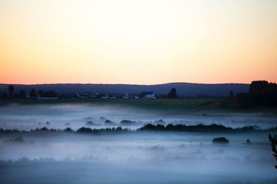 Scenic view of landscape against sky during sunset