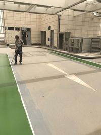 Full length of man standing by building in city