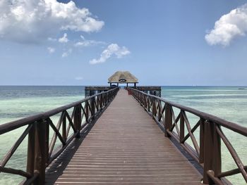 Pier over sea against sky