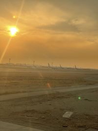 Scenic view of land against sky during sunset