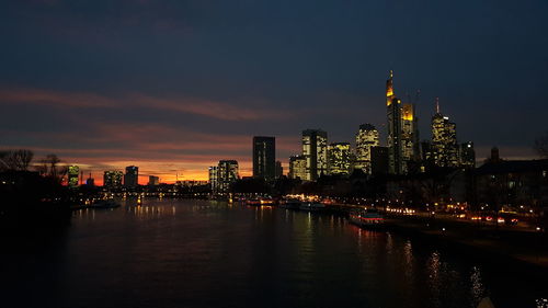 Illuminated buildings in city at night