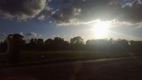 Scenic view of field against sky during sunset