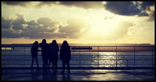 Silhouette of pier at sunset