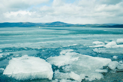 Scenic view of frozen sea against sky