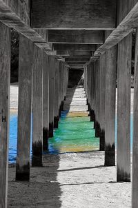 Wooden footbridge leading to pier