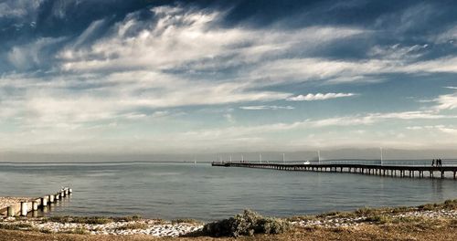 Bridge over sea against sky