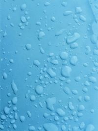 High angle view of raindrops on table