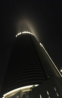 Low angle view of illuminated modern building