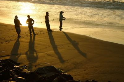 People playing on beach