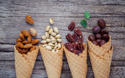 Directly above shot of ice cream cones filled with nuts