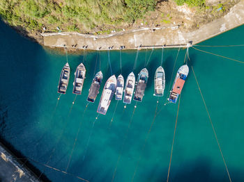 Aerial view of boats moored in river