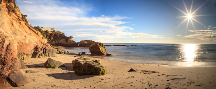 Rock keyhole and a long exposure of smooth water at pearl street beach in laguna beach, california