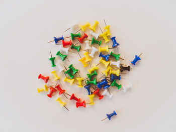 High angle view of colorful umbrellas against white background