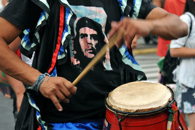 Midsection of man playing music concert