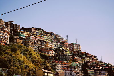 Low angle view of town against clear sky