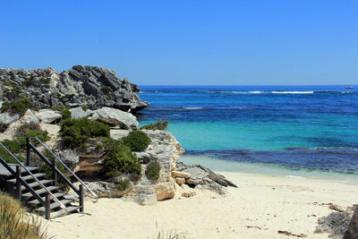 Scenic view of sea against clear blue sky