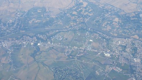 Aerial view of cityscape seen through glass window