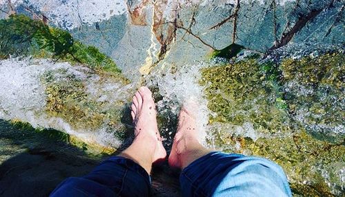 Low section of woman in water