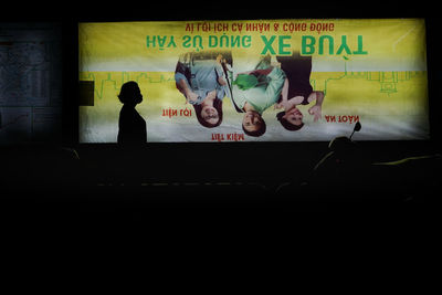 High angle view of people with text on wall