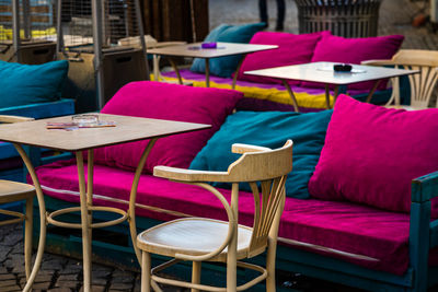 Empty chairs and tables in restaurant