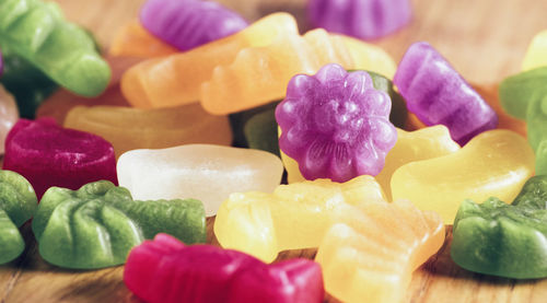 Close-up of candies on wooden table