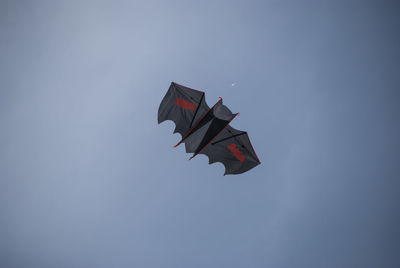 Low angle view of airplane flying in sky