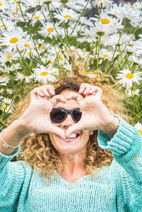 Rear view of woman looking through binoculars