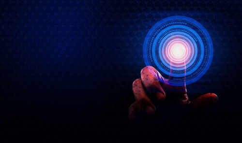 Close-up of hand holding illuminated lighting equipment
