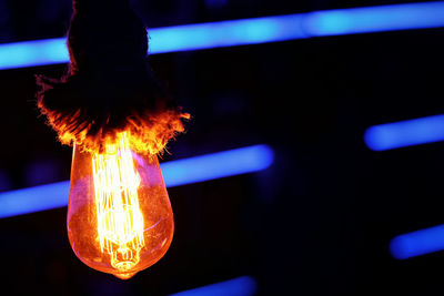 Close-up of illuminated light bulb