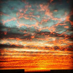 Low angle view of cloudy sky at sunset