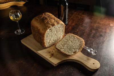 High angle view of bread and wine glass on table 