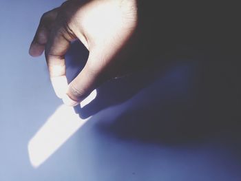 Close-up of human hand touching finger