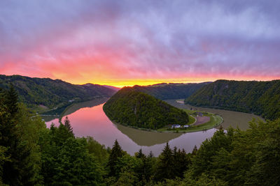 Scenic view of mountains against sky at sunset