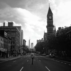 City street against cloudy sky