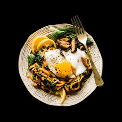 Egg recipe for breakfast on black background