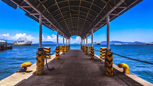 Rear view of woman walking on bridge