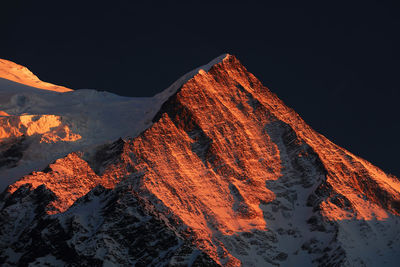 Panoramic view of mountains against sky at night
