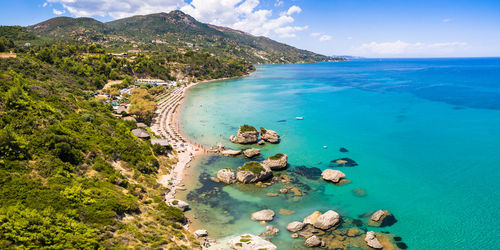 Aerial view of sea and landscape against sky