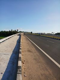 View of road against clear blue sky