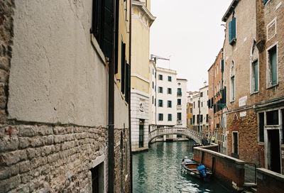 Canal amidst buildings in city