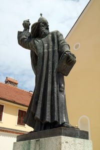 Low angle view of statue against sky