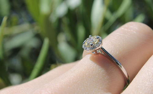 Close-up of woman hand holding hat