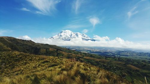 Scenic view of snowcapped mountains against sky