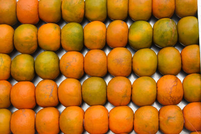 Full frame shot of orange fruits in market