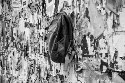 Woman standing by wall