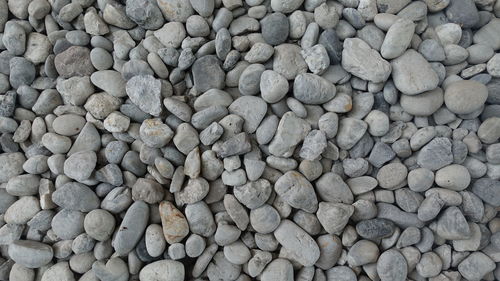 White and grey pebbles abstract background, nature wallpaper