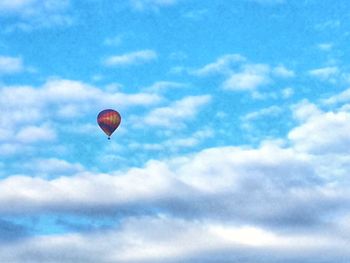 Low angle view of airplane flying in sky