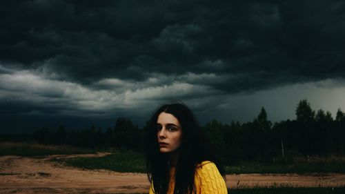 Young woman standing on field