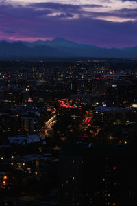 High angle view of illuminated buildings in city at night