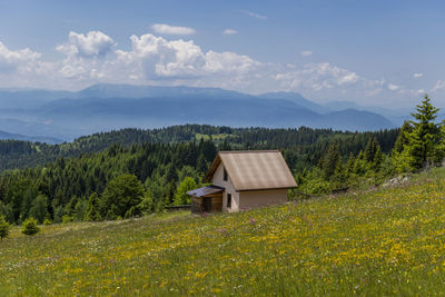 House on field against sky